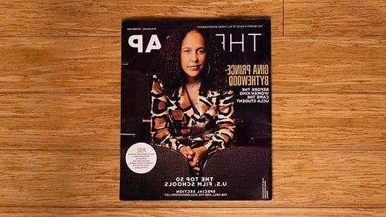 《the Wrap》杂志的鸟瞰图. The magazine cover is a picture of Gina Prince-Bythewood, 一个棕色头发的女人，穿着棕色和米色相间的运动上衣.